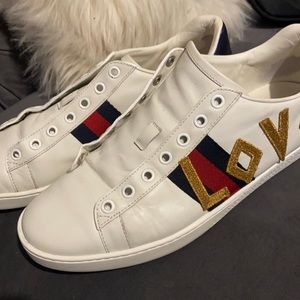 Gucci “ LOVED “ sneakers . Used no laces minor scratches and creases